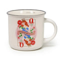 Porcelain mug with Queen-themed illustration.